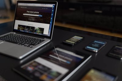 side by side view of phone and laptop