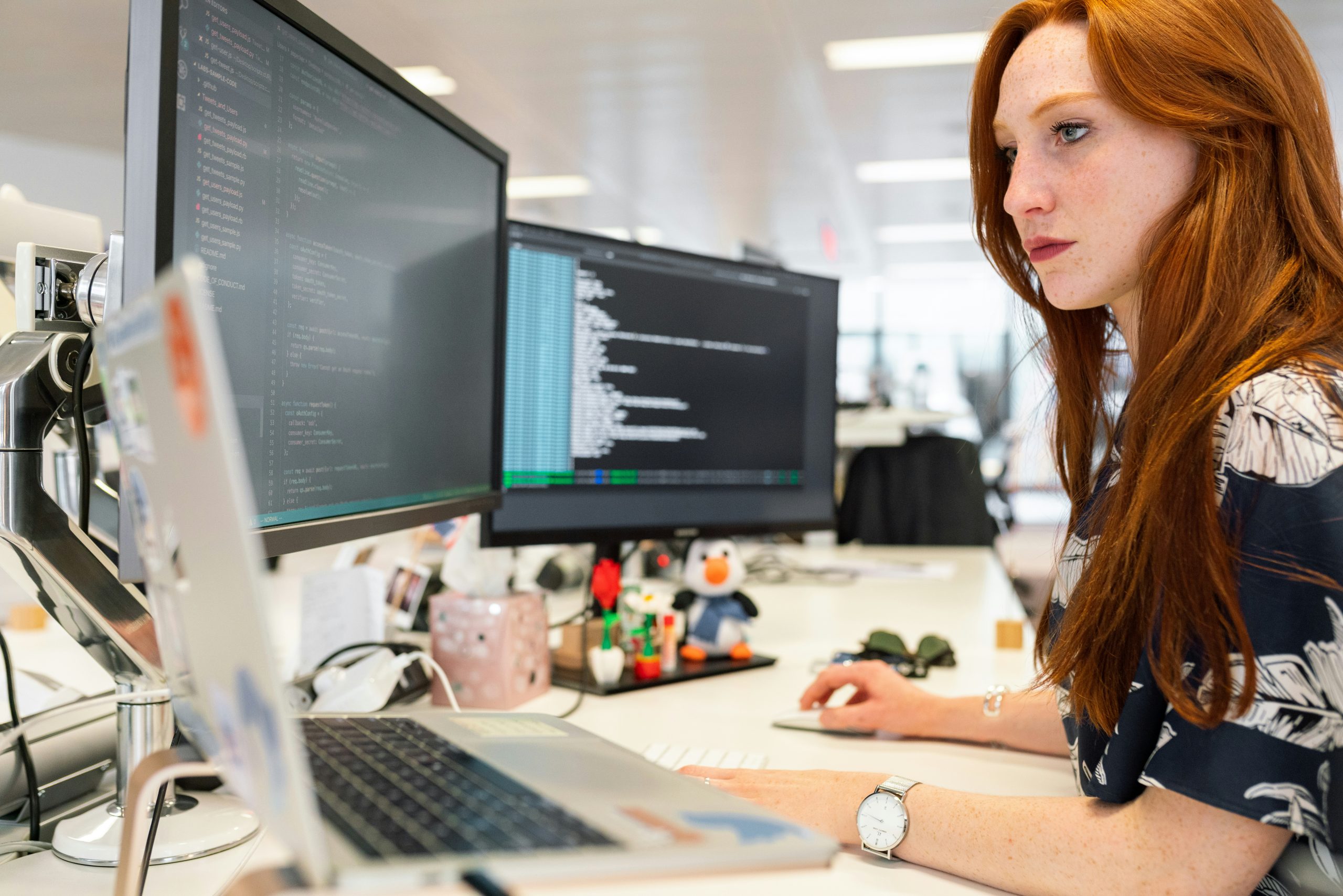 woman coding at her desk
